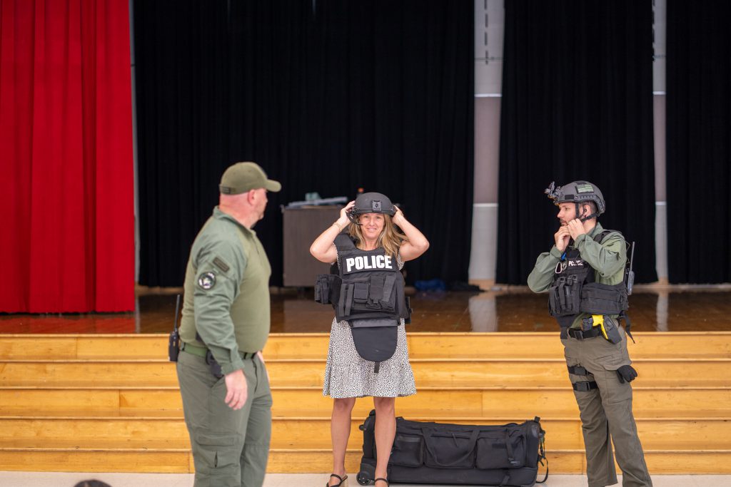 Principal Renee Vogt and two police members at assembly