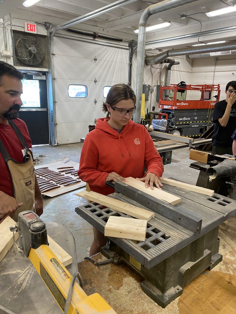 Students using tools and wood