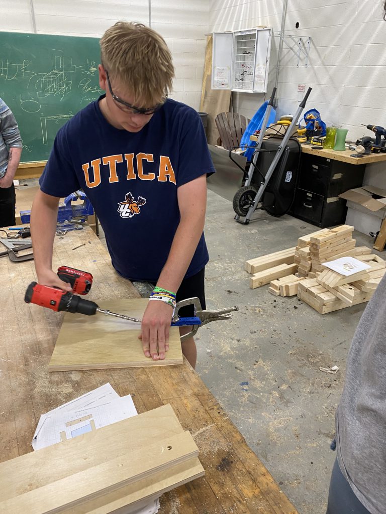 Students using tools and wood