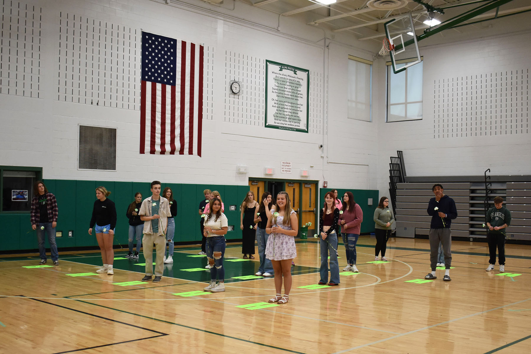 Seniors standing in gym for honoring of the seniors event