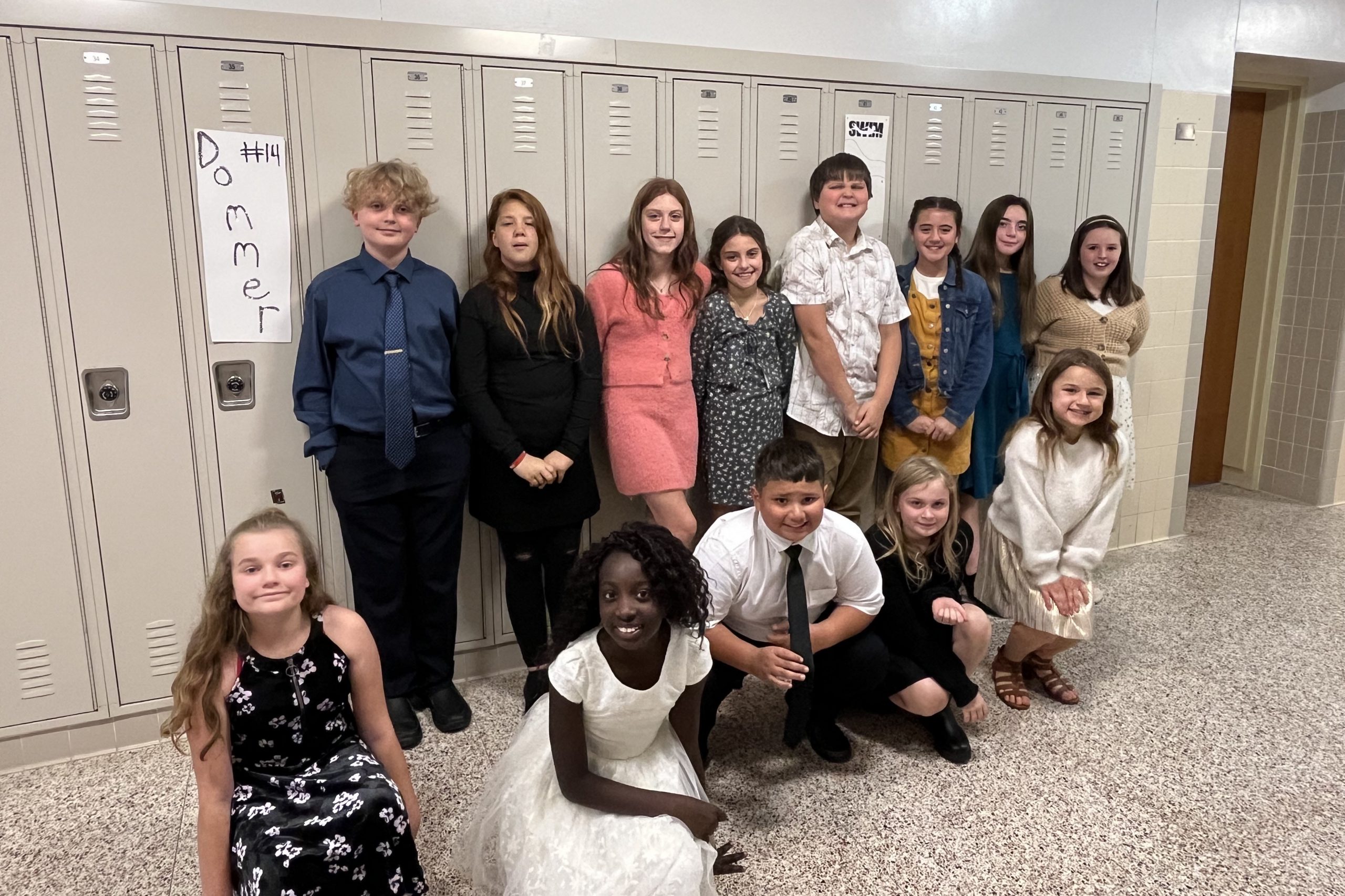 All County students posing in front of lockers