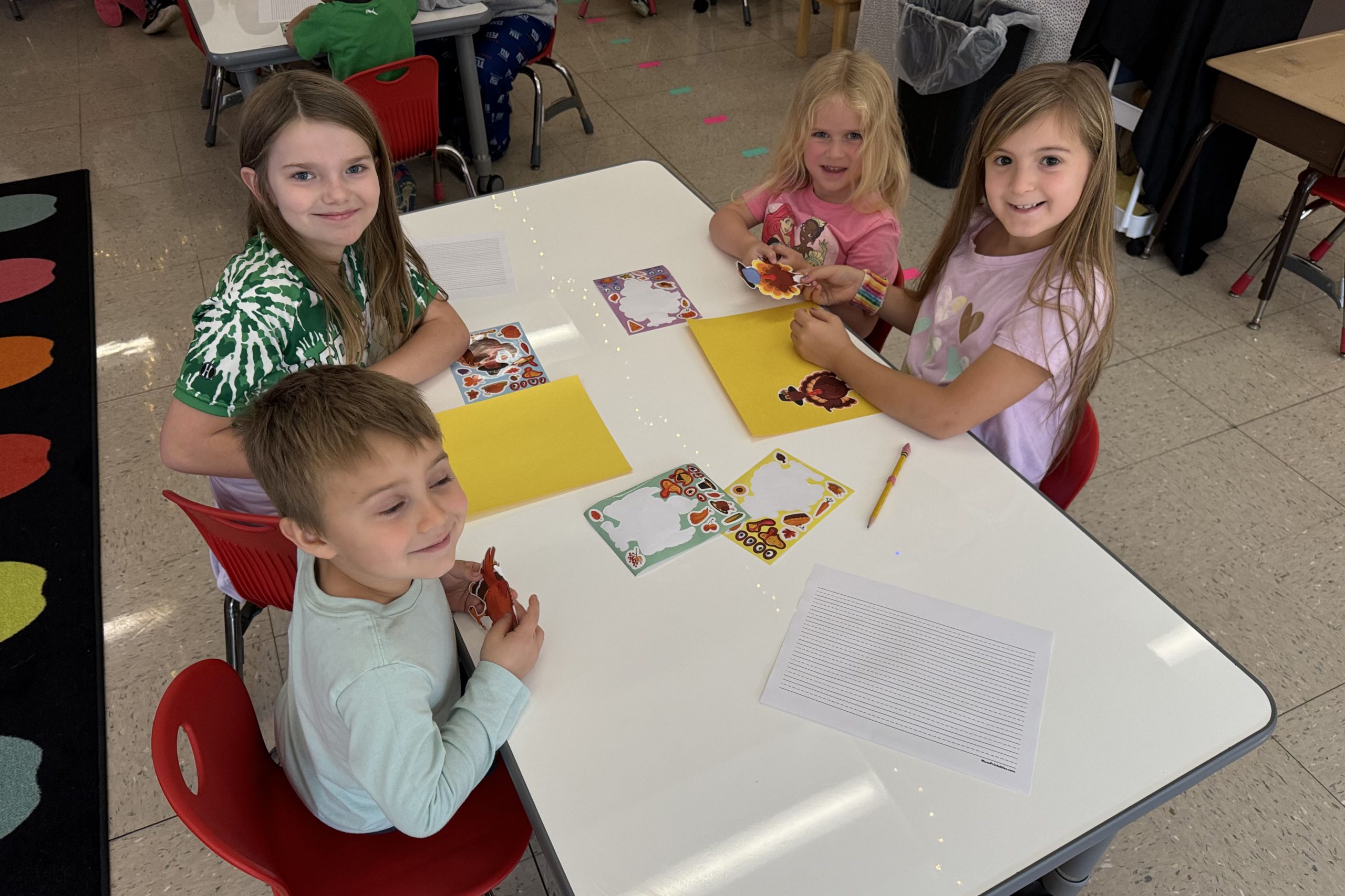 Four students sitting at a table