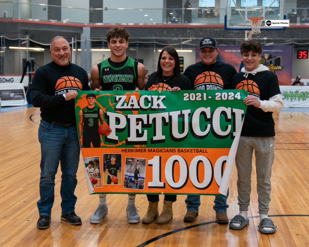 Zack Petucci and family with 1,000 point banner