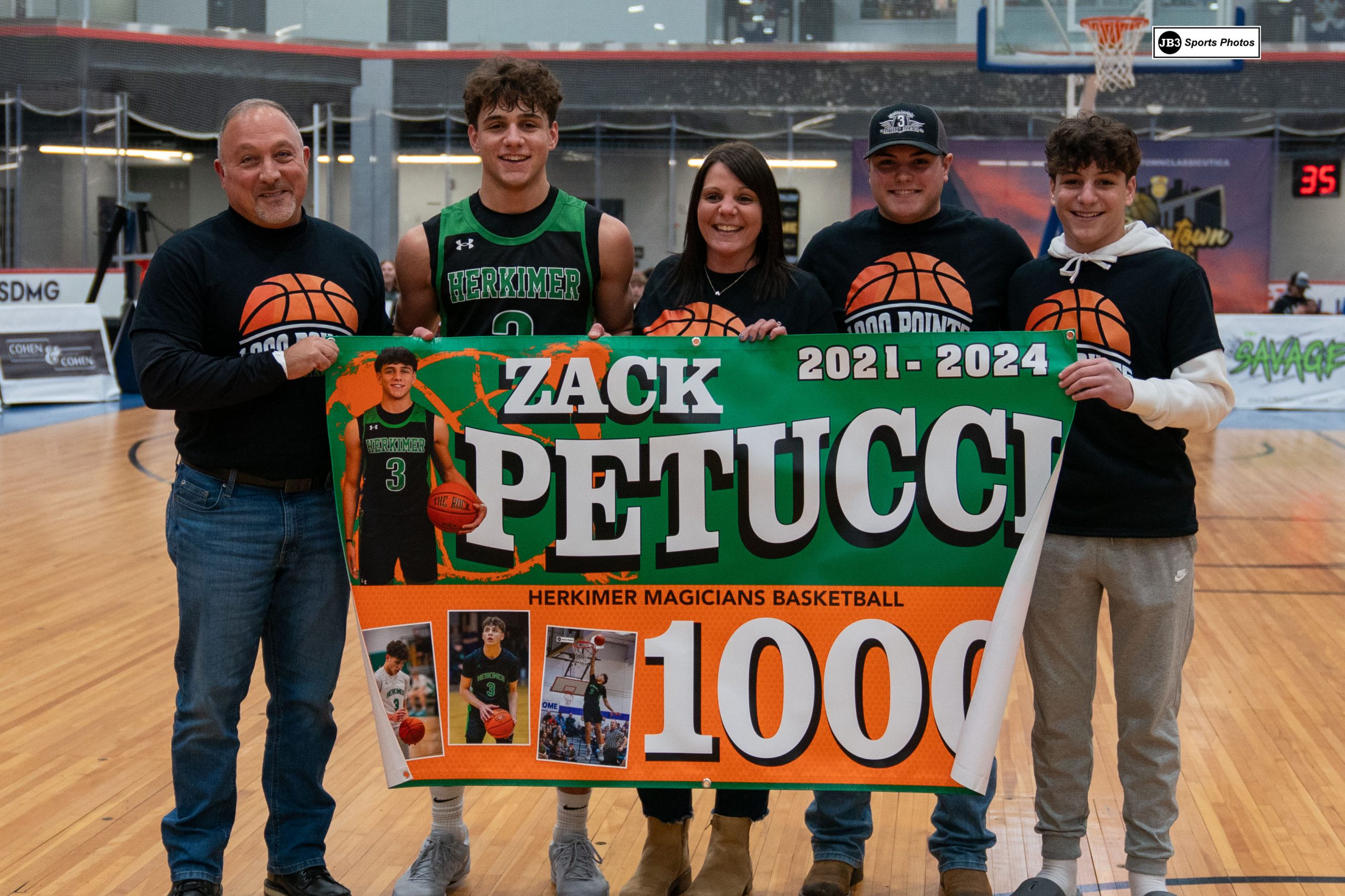 Zack Petucci and others celebrating 1,000 points