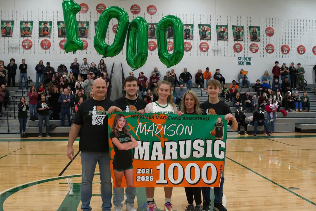 Madison Marusic and others celebrating 1,000 points