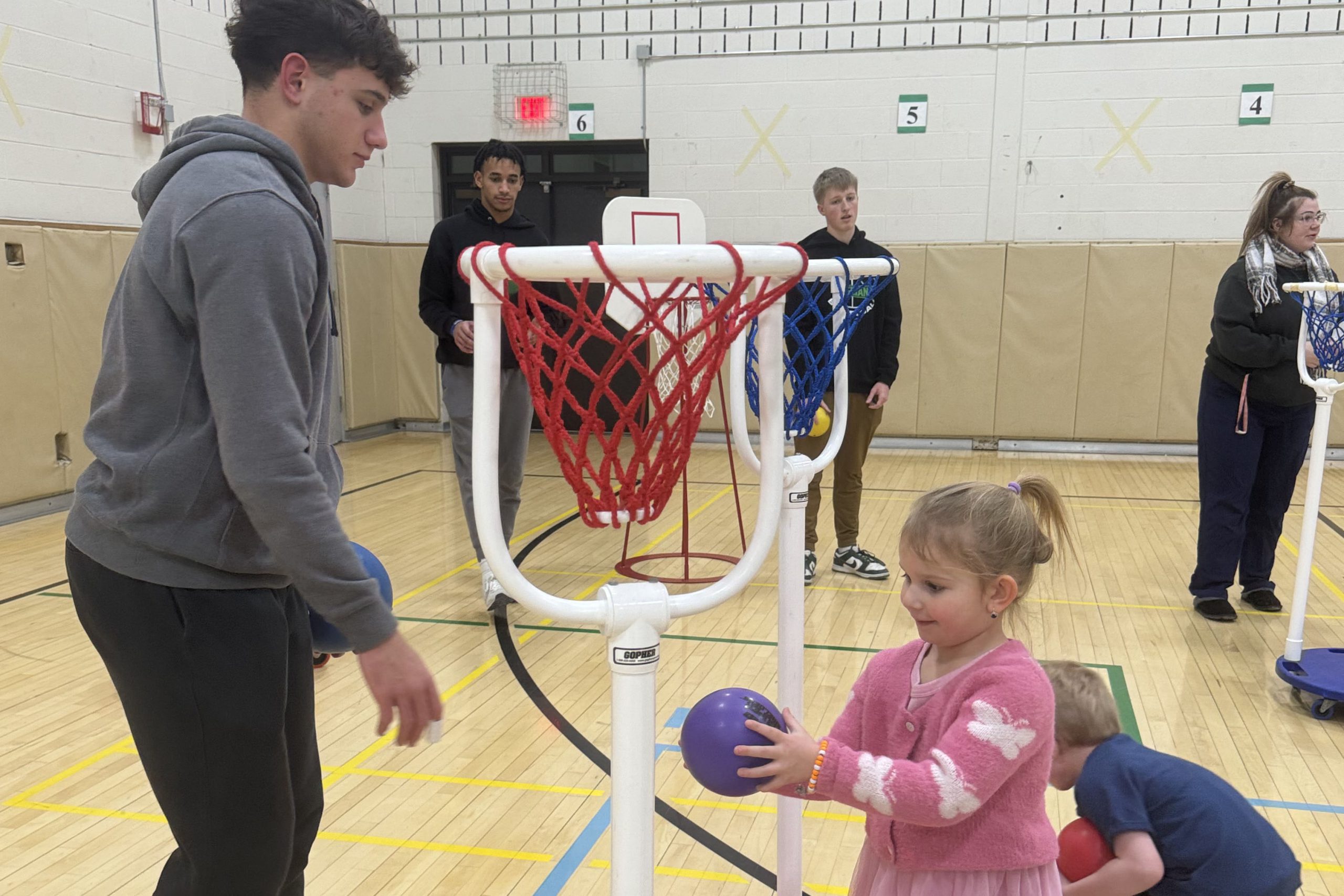 Varsity basketball with elementary students