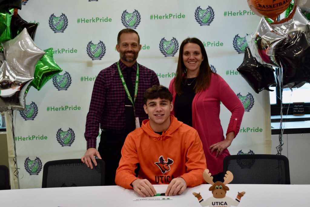 Zachary Petucci at commitment signing with Zach Abbe and Carolyn Saugh